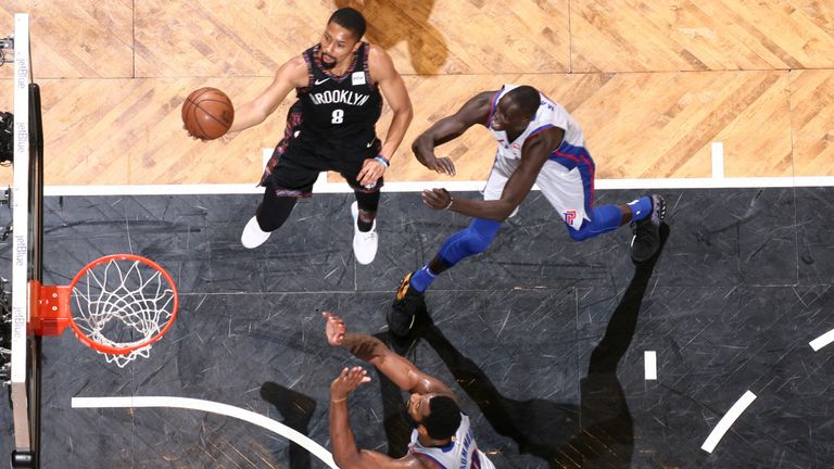 Spencer Dinwiddie scores with a lay-up against Detroit