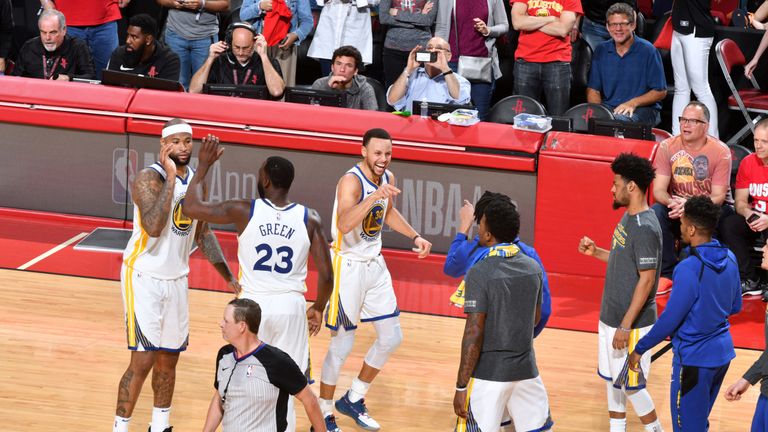 Stephen Curry celebrates victory over the Houston Rockets with his Golden State team-mates