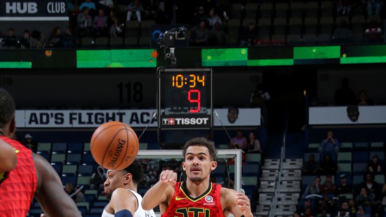 Trae Young throws an assist en route to a double-double against New Orleans