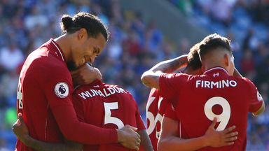 Virgil van Dijk congratulates Georginio Wijnaldum after his opener against Cardiff