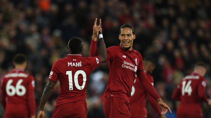 Sadio Mane and Virgil van Dijk celebrate during Liverpool's 5-0 win over Huddersfield