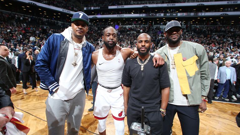 Carmelo Anthony, Chris Paul and LeBron James pose with friend Dwyane Wade after the Miami Heat icon played his final NBA game
