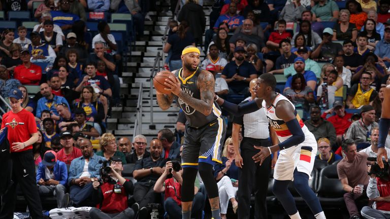 DeMarcus Cousins works in the post against the Pelicans