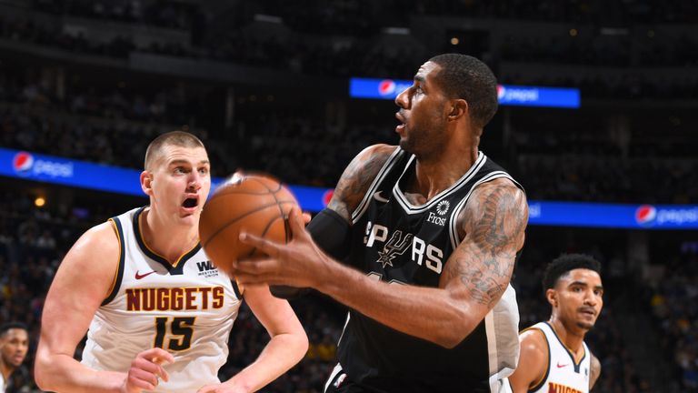 LaMarcus Aldridge sets up for a turnaround jump shot over Nikola Jokic