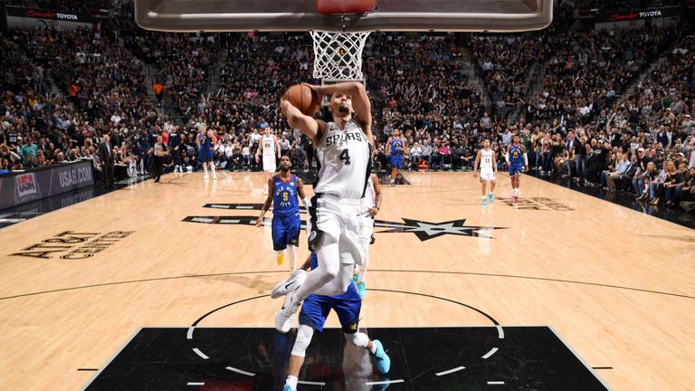 Derrick White scores with a dunk during the Spurs&#39; Game 3 win over the Nuggets