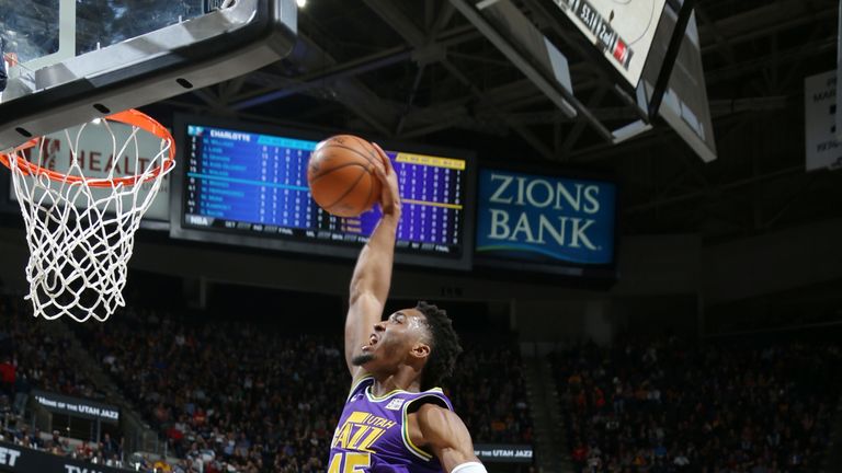 Donovan Mitchell soars for a dunk against Charlotte