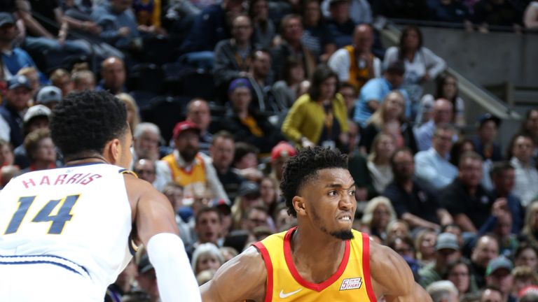 Donovan Mitchell looks to pass against Denver