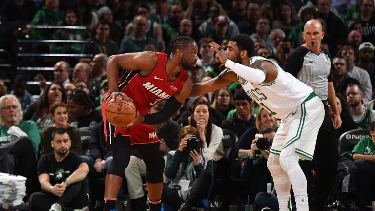 Dwyane Wade is guarded by Kyrie Irving