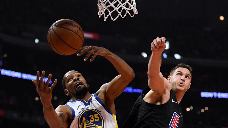 Kevin Durant contests a rebound with Danilo Gallinari