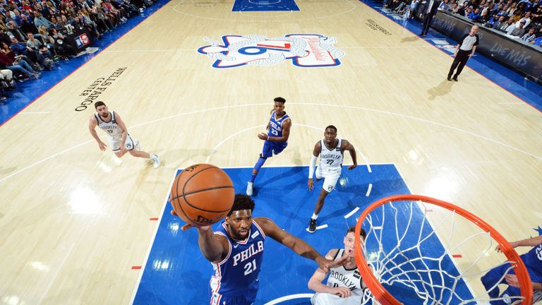 Joel Embiid scores at the rim against Brooklyn in Game 2