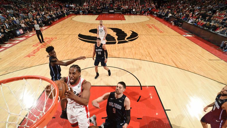 Kawhi Leonard soars to the rim during the Raptors' Game 2 win over the Magic