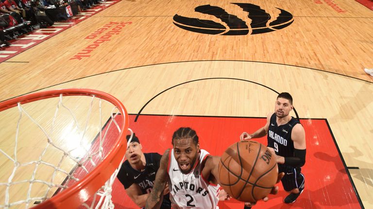 Kawhi Leonard finishes at the rim against Orlando in Game 5