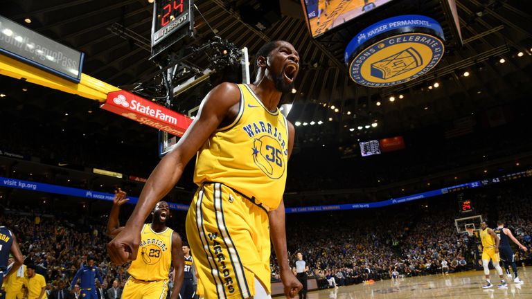 Kevin Durant celebrates after slamming home a coast-to-coast dunk against the Denver Nuggets