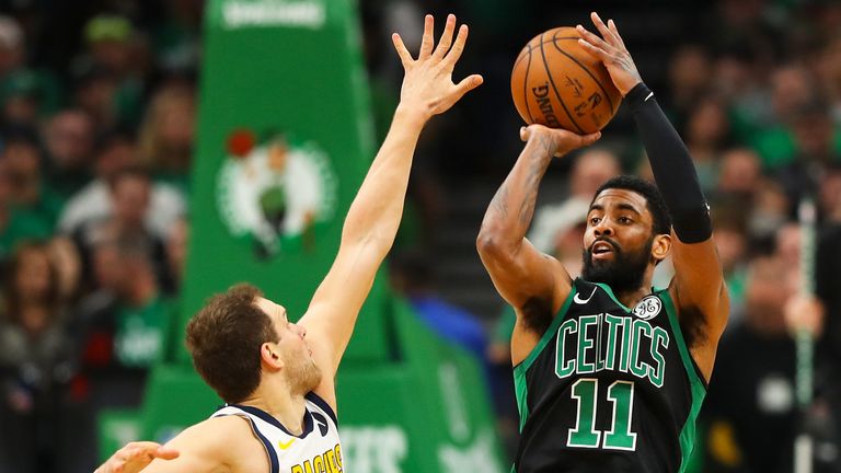 Kyrie Irving shoots a jumper over Bojan Bogdanovic