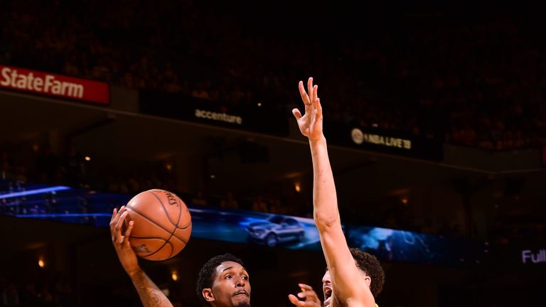 Lou Williams is defended closely by Klay Thompson