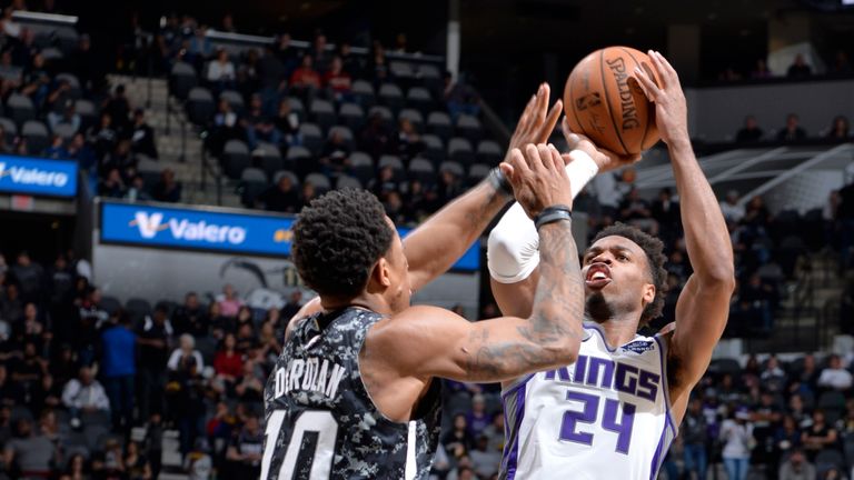 Buddy Hield shoots over DeMar DeRozan