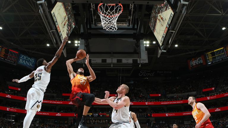 Rudy Gobert elevates to score against the Denver Nuggets