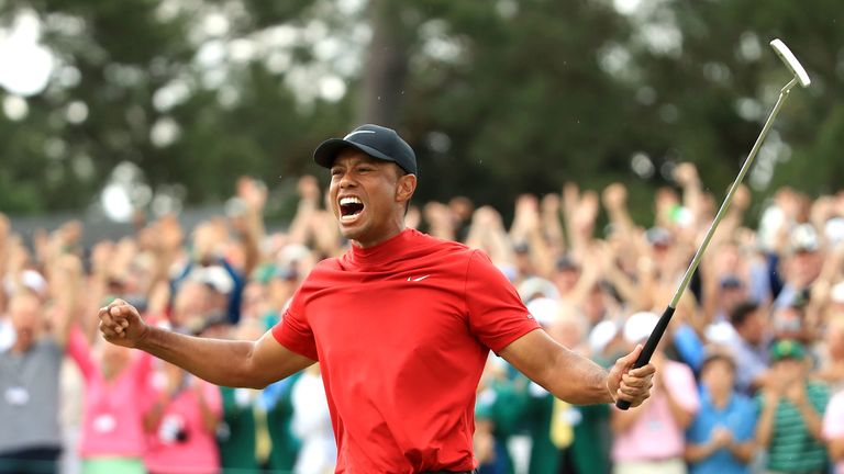 AUGUSTA, GEORGIA - APRIL 14: Tiger Woods of the United States celebrates after sinking his putt to win during the final round of the Masters at Augusta National Golf Club on April 14, 2019 in Augusta, Georgia. (Photo by Andrew Redington/Getty Images)
