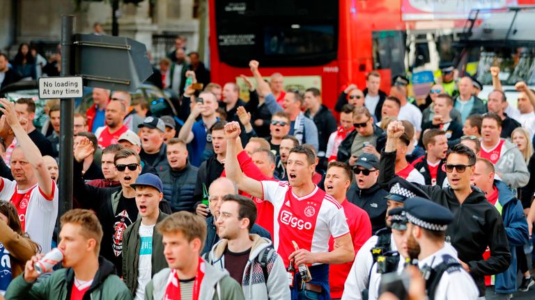 Ajax supporters march through central London ahead of the Champions League semi-final first leg football against Tottenham