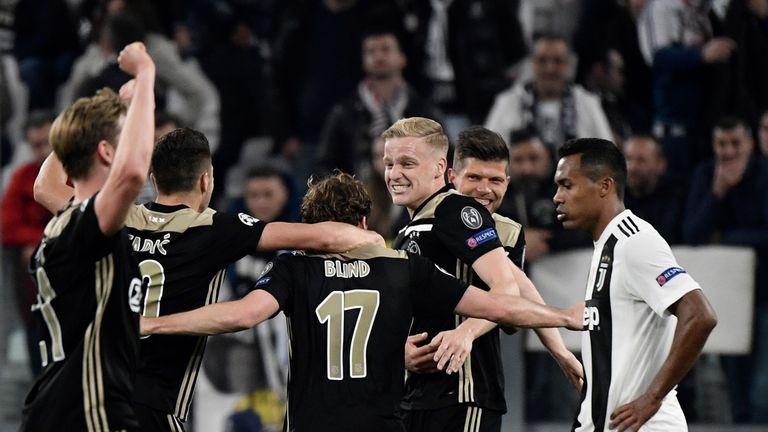 Ajax celebrate their victory in Turin to reach the Champions League last four