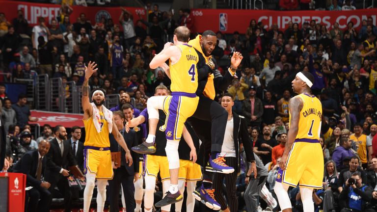 Alex Caruso #4 of the Los Angeles Lakers celebrates with LeBron James #23 of the Los Angeles Lakers against the LA Clippers on April 5, 2019 at STAPLES Center in Los Angeles, California.