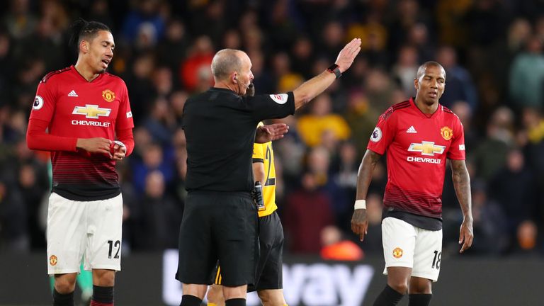 Ashley Young is sent off by Mike Dean