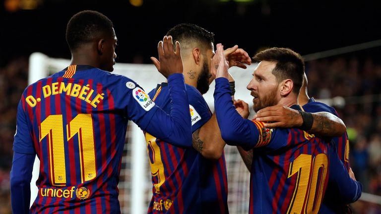 Barcelona players celebrate a goal inside the Nou Camp