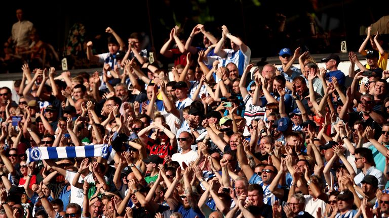 Brighton fans celebrate at the final whistle after earning a second away clean sheet this term