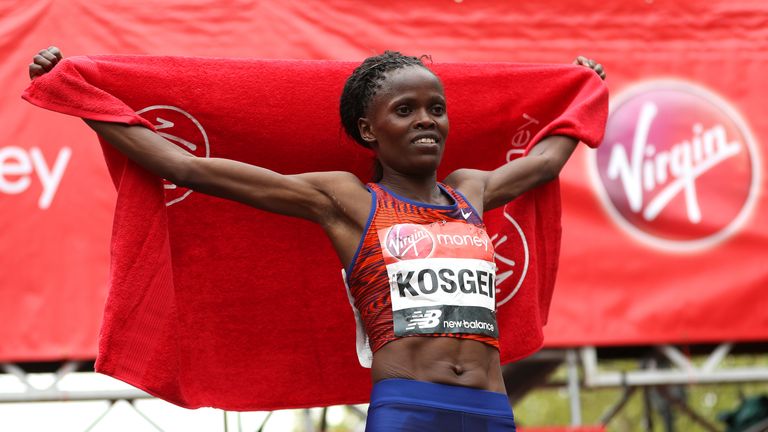 Brigid Kosgei of Kenya celebrates winning the Women's Elite race during the 2019 Virgin Money London Marathon in the United Kingdom on April 28, 2019 in London, England