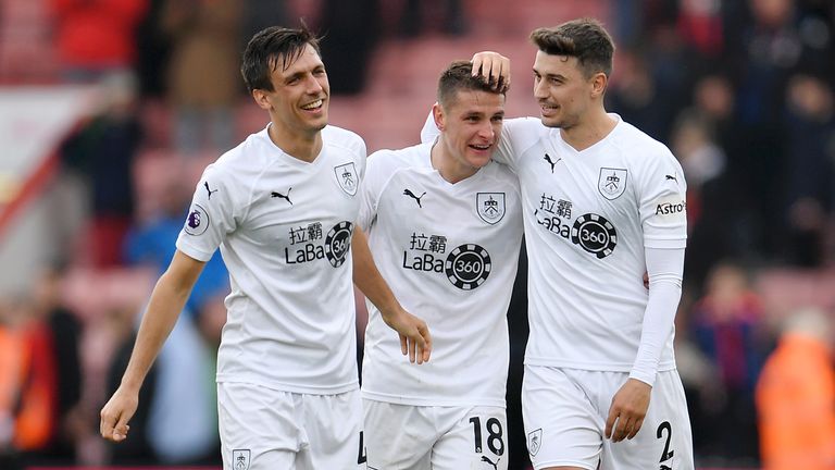 Jack Cork of Burnley, Ashley Westwood of Burnley and Matthew Lowton of Burnley celebrate victory together after the Premier League match between AFC Bournemouth and Burnley FC at Vitality Stadium on April 06, 2019 in Bournemouth, United Kingdom. 