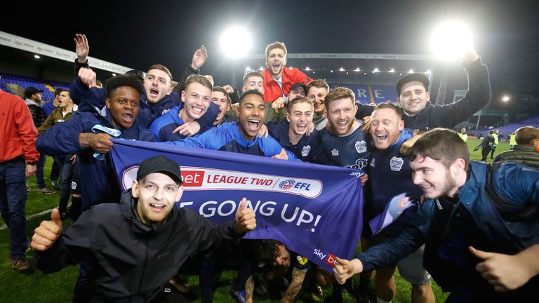 Bury players and fans celebrate promotion 