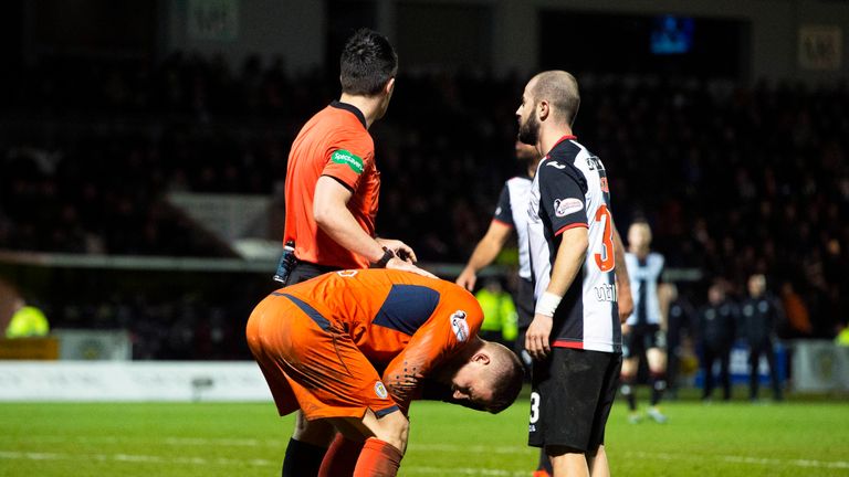 Vaclav Hladky reacts after an object is thrown from the Celtic fans