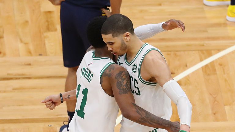 Kyrie Irving of the Boston Celtics and Jayson Tatum celebrate during the fourth quarter of Game Two of Round One of the 2019 NBA Playoffs against the Indiana Pacers