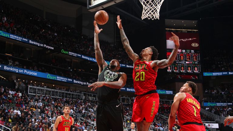 Sterling Brown of the Milwaukee Bucks drives to the basket during the game against John Collins of the Atlanta Hawks