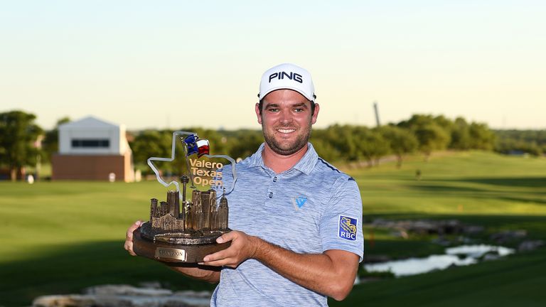 Corey Conners proudly displays the Valero Texas Open trophy