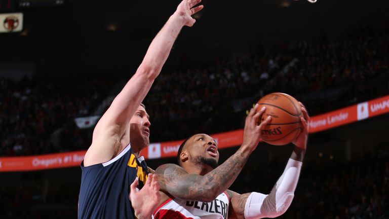 Damian Lillard #0 of the Portland Trail Blazers goes to the basket against the Denver Nuggets on April 7, 2019 at the Moda Center in Portland, Oregon. 
