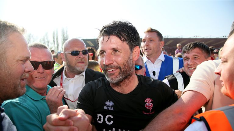 Lincoln City Manager Danny Cowley is mobbed by fans after the Sky Bet League Two match at Sincil Bank, Lincoln. PRESS ASSOCIATION Photo. Picture date: Monday April 22, 2019. See PA story SOCCER Lincoln. Photo credit should read: Richard Sellers/PA Wire. RESTRICTIONS: EDITORIAL USE ONLY No use with unauthorised audio, video, data, fixture lists, club/league logos or "live" services. Online in-match use limited to 120 images, no video emulation. No use in betting, games or single club/league/player publications. 