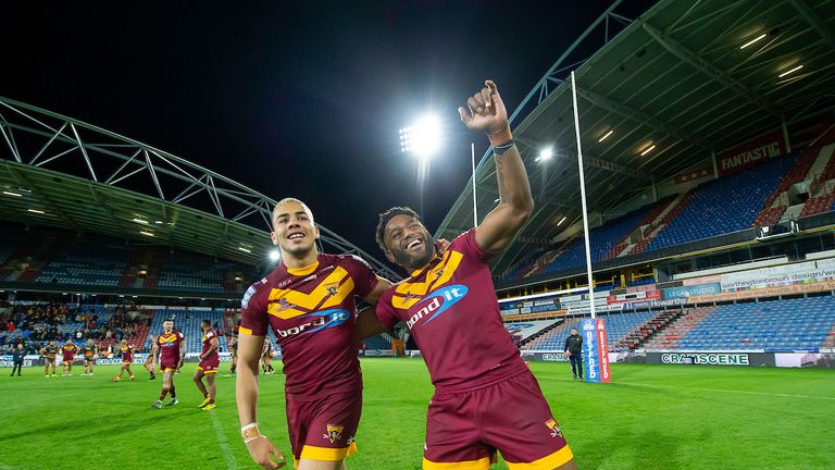 Huddersfield&#39;s Darnell McIntosh & Akuila Uate celebrate to the fans after victory over Castleford