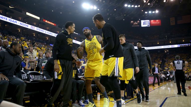 DeMarcus Cousins #0 of the Golden State Warriors is helped off the court after injuring himself against the LA Clippers during Game Two of the first round of the 2019 NBA Western Conference Playoffs at ORACLE Arena on April 15, 2019 in Oakland, California.