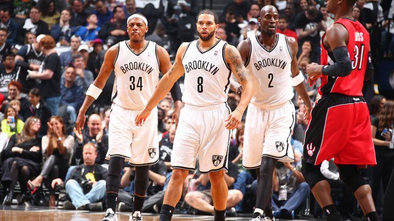 Deron Williams #8 and Kevin Garnett #2 of the Brooklyn Nets walk up court against the Toronto Raptors during Game Four of the Eastern Conference Quarterfinals at Barclays Center in Brooklyn.