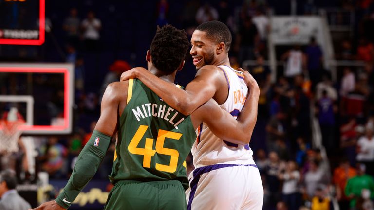 Donovan Mitchell of the Utah Jazz and Mikal Bridges of the Phoenix Suns hug after the game