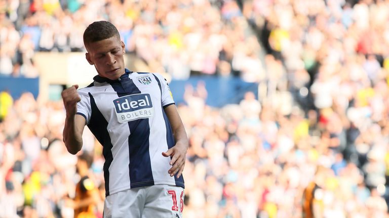 Dwight Gayle celebrates after making it 3-2 to West Bromwich Albion