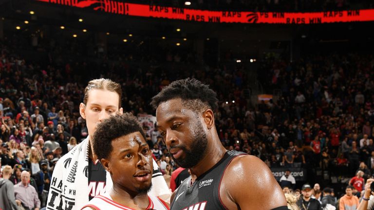 Kyle Lowry #7 of the Toronto Raptors and Dwyane Wade #3 of the Miami Heat embrace following the game on April 7, 2019 at the Scotiabank Arena in Toronto, Ontario, Canada.