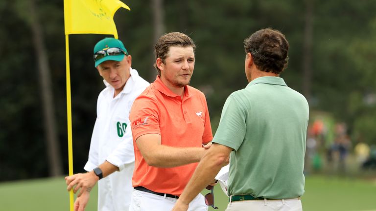 Eddie Pepperell shakes hands with marker Jeff Knox after the third round of the Masters