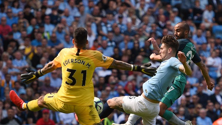 Ederson makes a save to prevent Lucas Moura from equalising