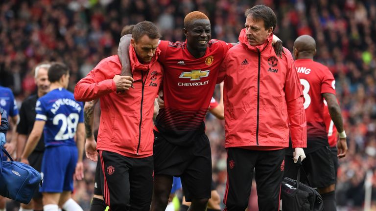 Manchester United's Eric Bailly leaves the pitch after picking up an injury