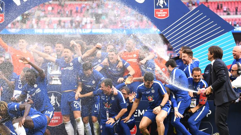 Antonio Conte sprays champagne over his Chelsea players after last year's FA Cup final