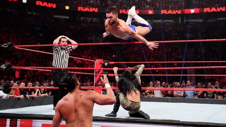 Finn Balor jumps over Zelina Vega to hit Andrade
