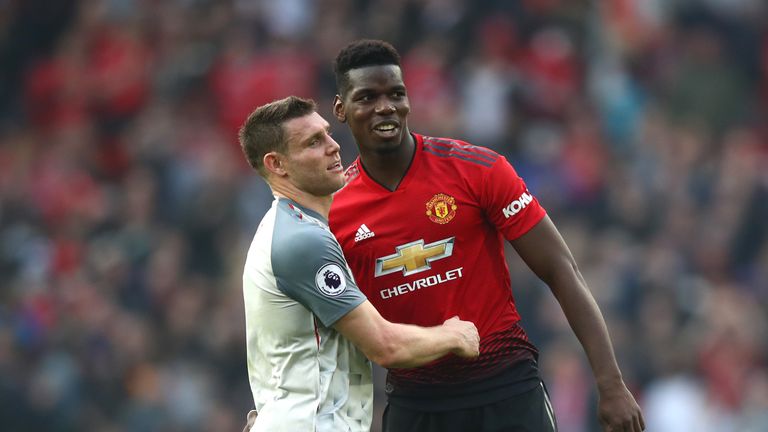 James Milner shakes hands with Paul Pogba