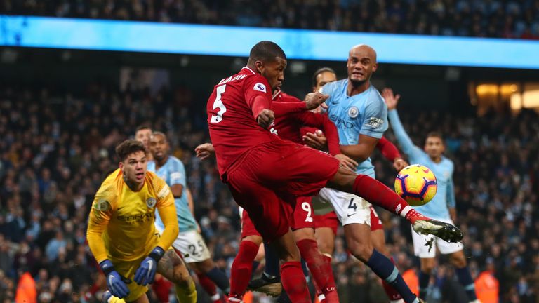 Georginio Wijnaldum of Liverpool clears the ball during the Premier League match between Manchester City and Liverpool 